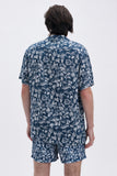 Blue Shirt with 'Le Bel Été' print, a stylish collaboration by Edith Carron.