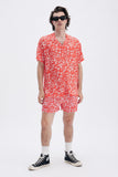 Red Shirt with 'Le Bel Été' print, a stylish collaboration by Edith Carron.