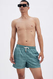 Green Swim Shorts with 'Leone' print, a stylish collaboration by Uberta Zambeletti.