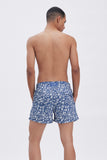 Blue Swim Shorts with 'Le Bel Été' print, a stylish collaboration by Edith Carron.