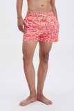 Red Swim Shorts with 'Le Bel Été' print, a stylish collaboration by Edith Carron.