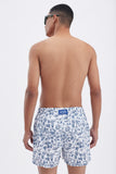 White Swim Shorts with 'Le Bel Été' print, a stylish collaboration by Edith Carron.