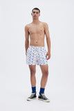 Beige Swim Shorts with 'La Plage' print, a stylish collaboration by Matías Larrain.
