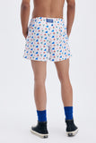 Beige Swim Shorts with 'La Plage' print, a stylish collaboration by Matías Larrain.