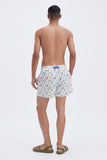 White Swim Shorts with 'Lucky Charms' print, a stylish collaboration by Mary Matson.