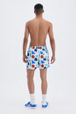 White Swim Shorts with 'Hellas' print, a stylish collaboration by Julie Safirstein.