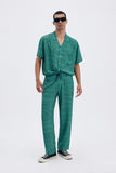 Green Iconic Pants with 'Leone' print, a stylish collaboration by Uberta Zambeletti.