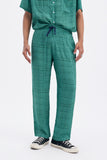 Green Iconic Pants with 'Leone' print, a stylish collaboration by Uberta Zambeletti.