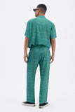 Green Iconic Pants with 'Leone' print, a stylish collaboration by Uberta Zambeletti.